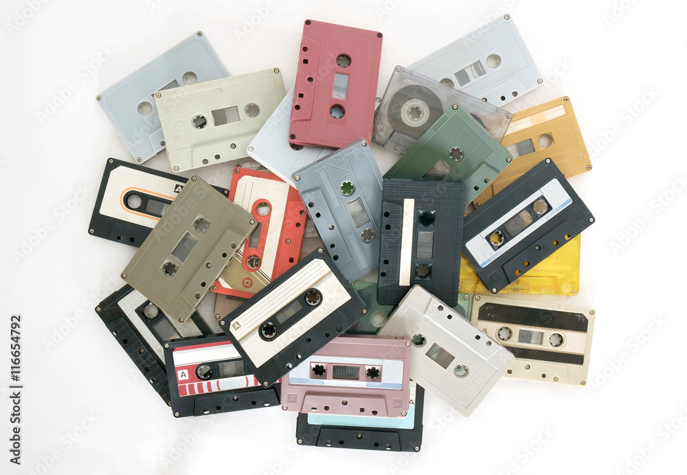 Cassette tapes / Heap of retro cassette tapes on white background. Top view. Flat lay. Cassette tapes / Heap of retro cassette tapes on white background. Top view. Flat lay.