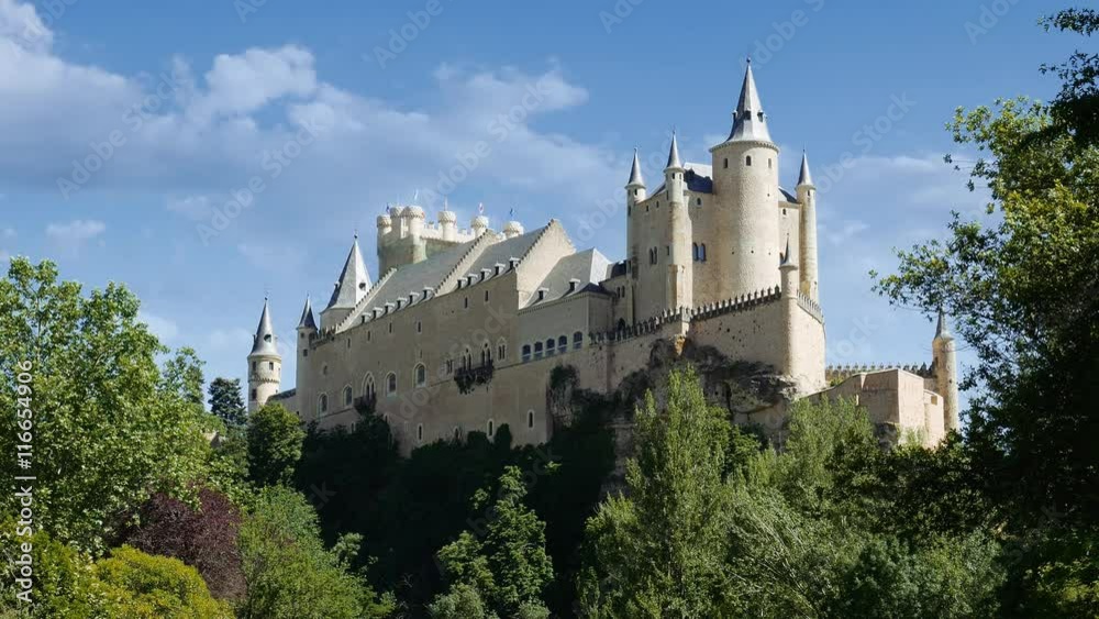 Middle age castle, romantic medieval fortress with perfect evening colored sunset light and beautiful clouds. The spanish castle Alcazar of Segovia, in Castilla y Leon, Spain Middle age castle, romantic medieval fortress with perfect evening colored sunset light and beautiful clouds. The spanish castle Alcazar of Segovia, in Castilla y Leon, Spain