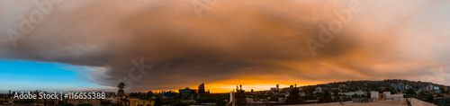 Smoke from Sand brush fire covering West Hollywood cityscape at sunset. Los Angeles, California, July 24, 2016.