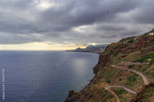 winding road goes down to the beach Ponta do Garajau, Madeira, Portugal