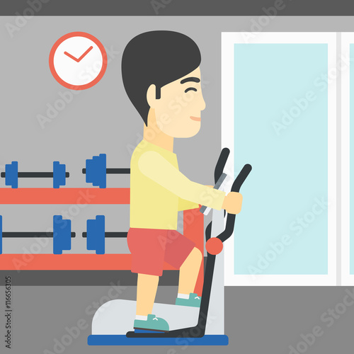 Man exercising on elliptical trainer.