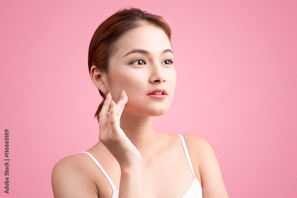 Portrait of beautiful young asian woman with perfect skin on pin Portrait of beautiful young asian woman with perfect skin on pin