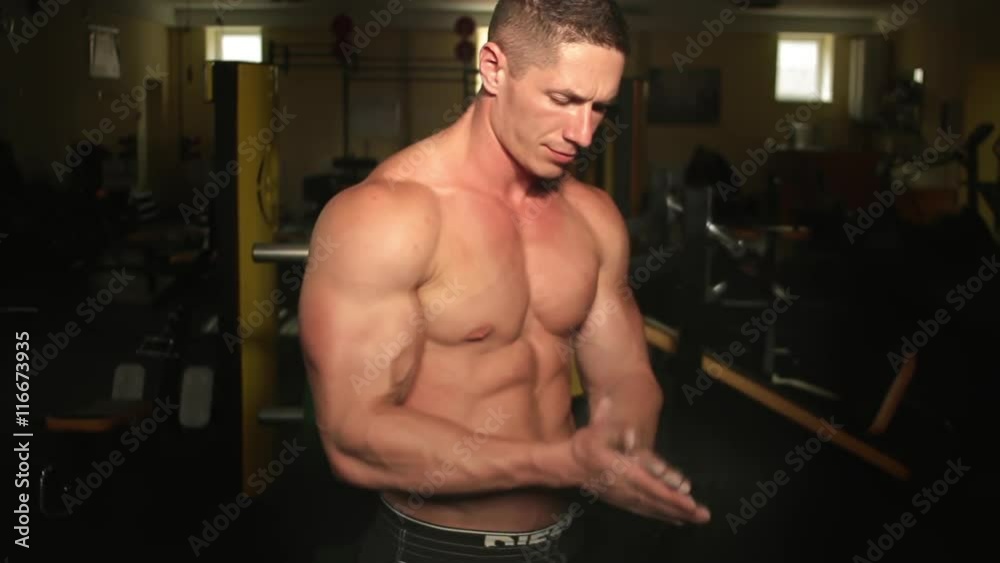 The athlete is preparing to start training in the gym The athlete is preparing to start training in the gym