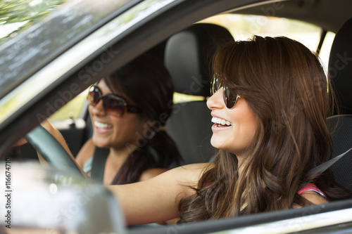 Young woman taking a road trip. Friends driving.  © digitalskillet1