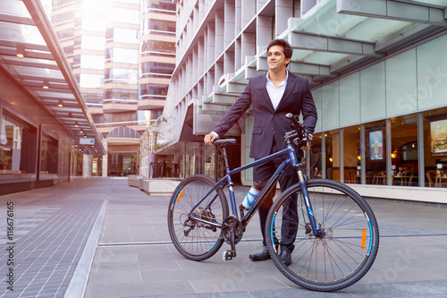 Successful businessman with bicycle