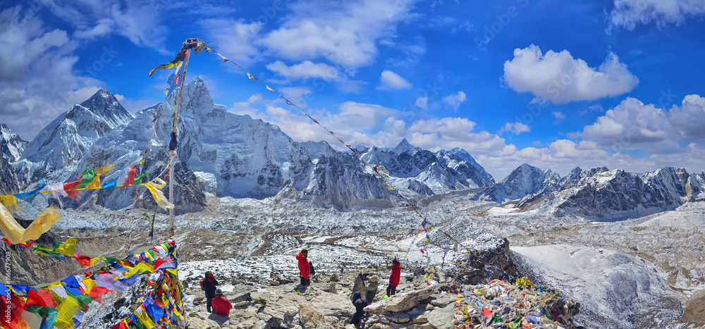 Naklejka premium View of Mount Everest and Nuptse with buddhist prayer flags from kala patthar in Sagarmatha National Park in the Nepal Himalaya