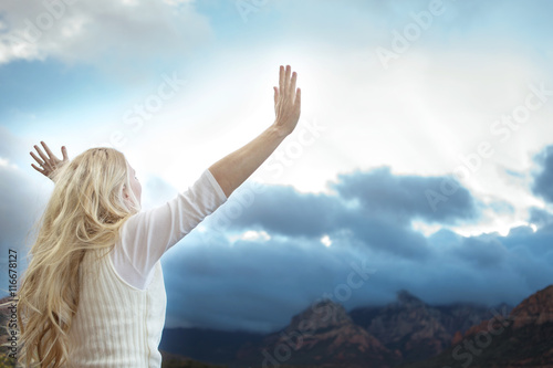 Woman with raised hands.