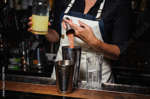 Barman is making a cocktail