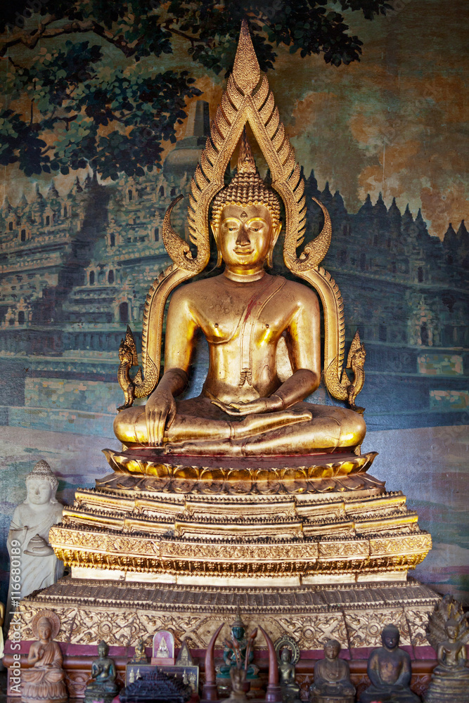 Gilded figure of Buddha in the temple. Indonesia Gilded figure of Buddha in the temple. Indonesia