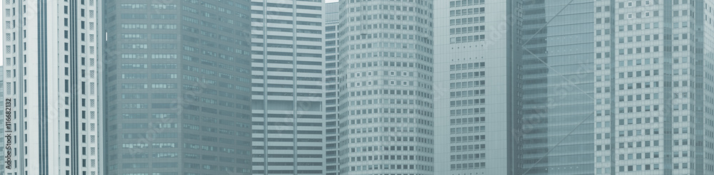 Panoramic background - windows of high-rise city buildings Panoramic background - windows of high-rise city buildings