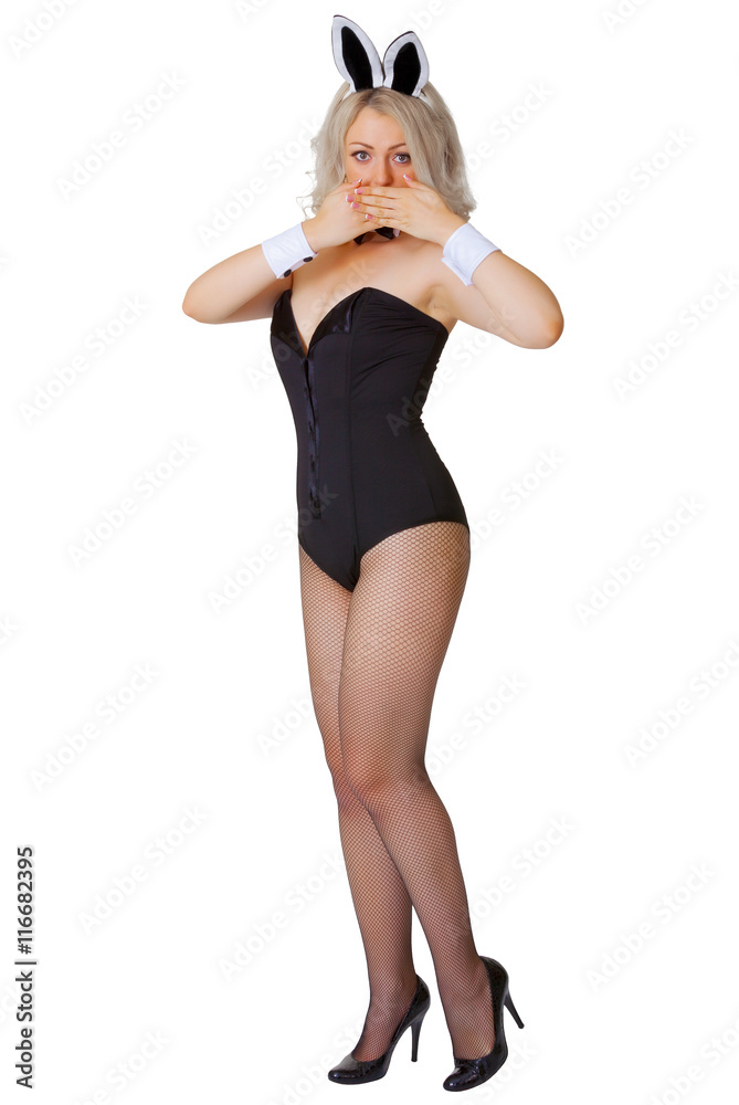 Beautiful young girl in a bunny suit coyly covers her mouth Beautiful young girl in a bunny suit coyly covers her mouth