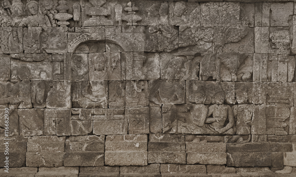 Fototapeta premium Medieval carving on the walls of the Borobudur temple