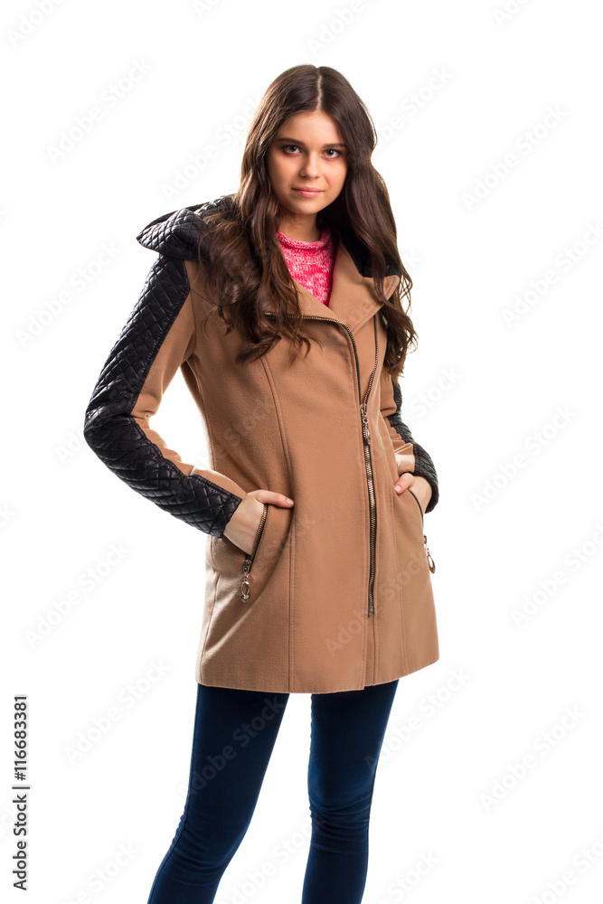 Woman in beige coat. Pants of dark navy color. Fleece coat with leather inserts. Outerwear from new boutique. Woman in beige coat. Pants of dark navy color. Fleece coat with leather inserts. Outerwear from new boutique.