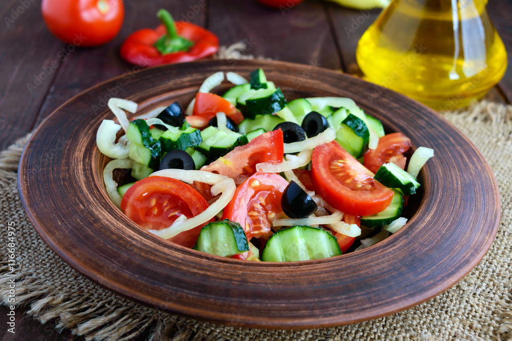 Dietary salad with vegetables, olives and oil. Mediterranean Kitchen. Dietary salad with vegetables, olives and oil. Mediterranean Kitchen.
