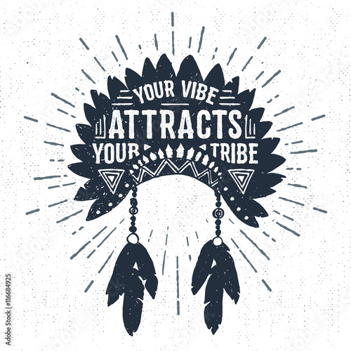 Hand drawn tribal label with textured headdress vector illustration and "Your vibe attracts your tribe" inspirational lettering.