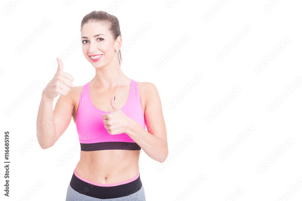 Female fitness trainer showing okay gesture Female fitness trainer showing okay gesture