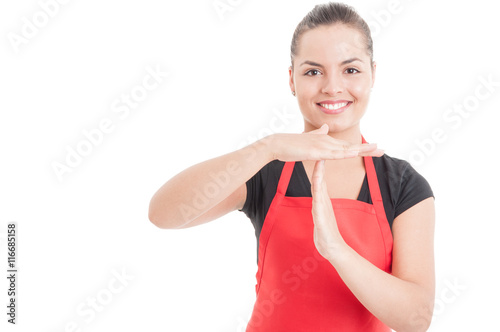 Portrait of female employee doing timeout gesture photo