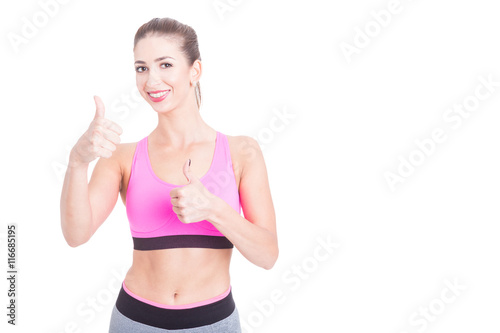 Female fitness trainer showing okay gesture © Catalin Pop