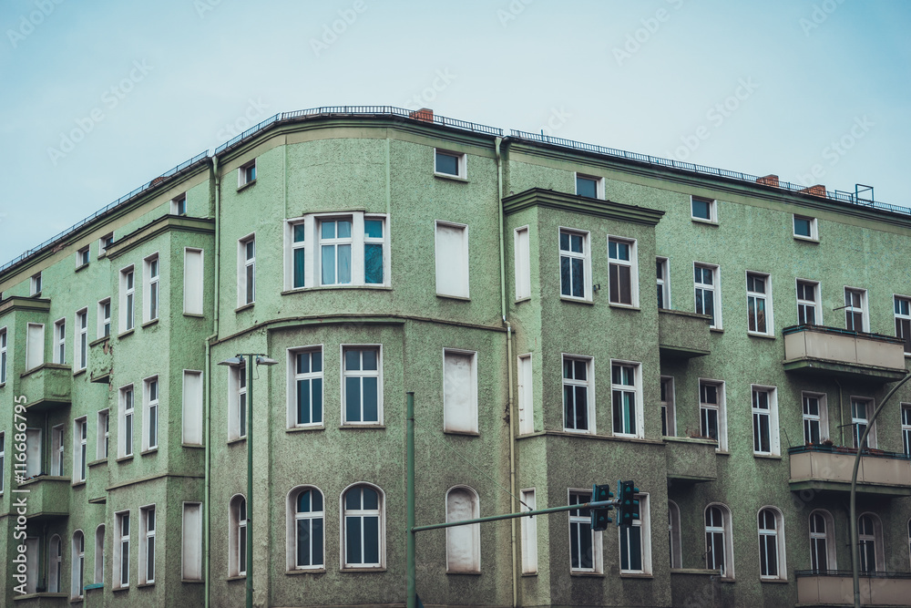 Naklejka premium Apartments with curved corner and green exterior