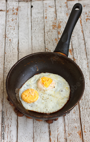 Scrambled eggs in an iron pan