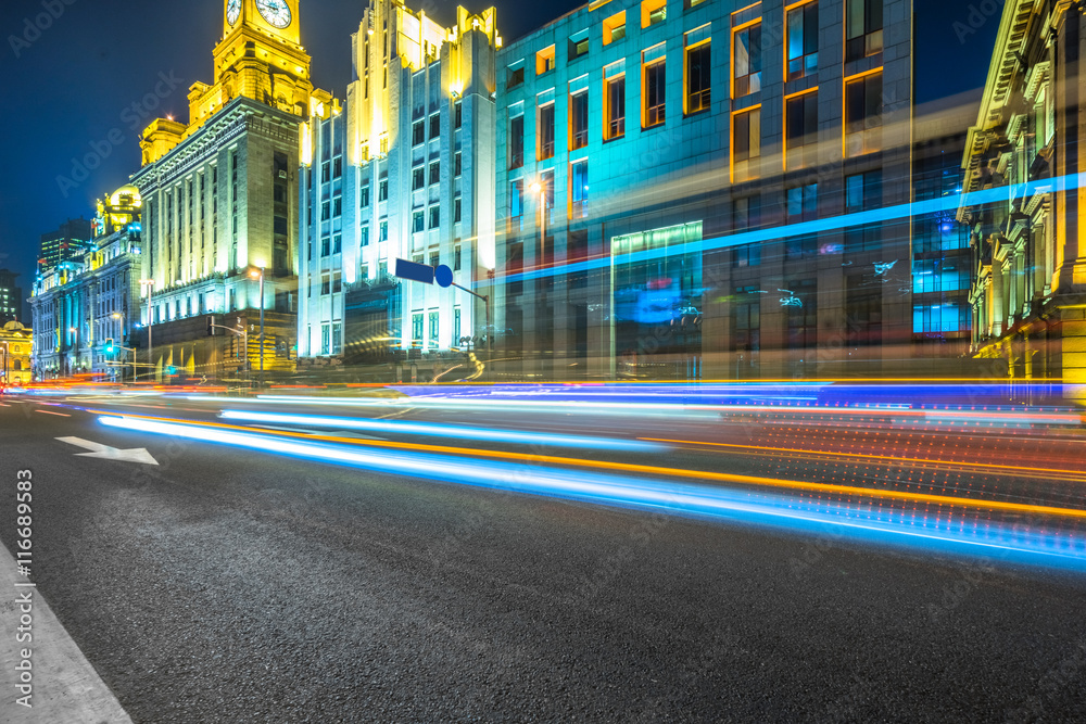 Obraz premium light trails at downtown district,shanghai china.