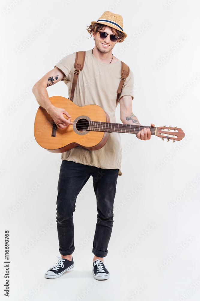 Handsome man in sunglasses playing on the guitar Handsome man in sunglasses playing on the guitar