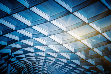 glass sunshade structure,blue toned image.