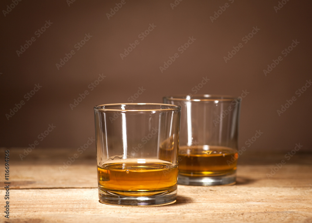 Whiskey on wooden background Whiskey on wooden background