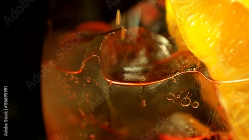Closeup view, ice cocktail with tonic and orange 