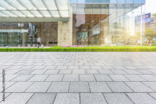 Empty brick floor with modern building in Shanghai