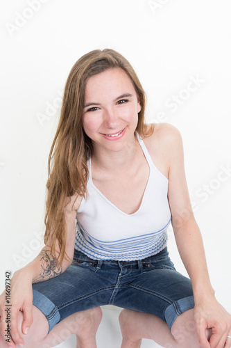 Beautiful young woman posing and looking with smile
