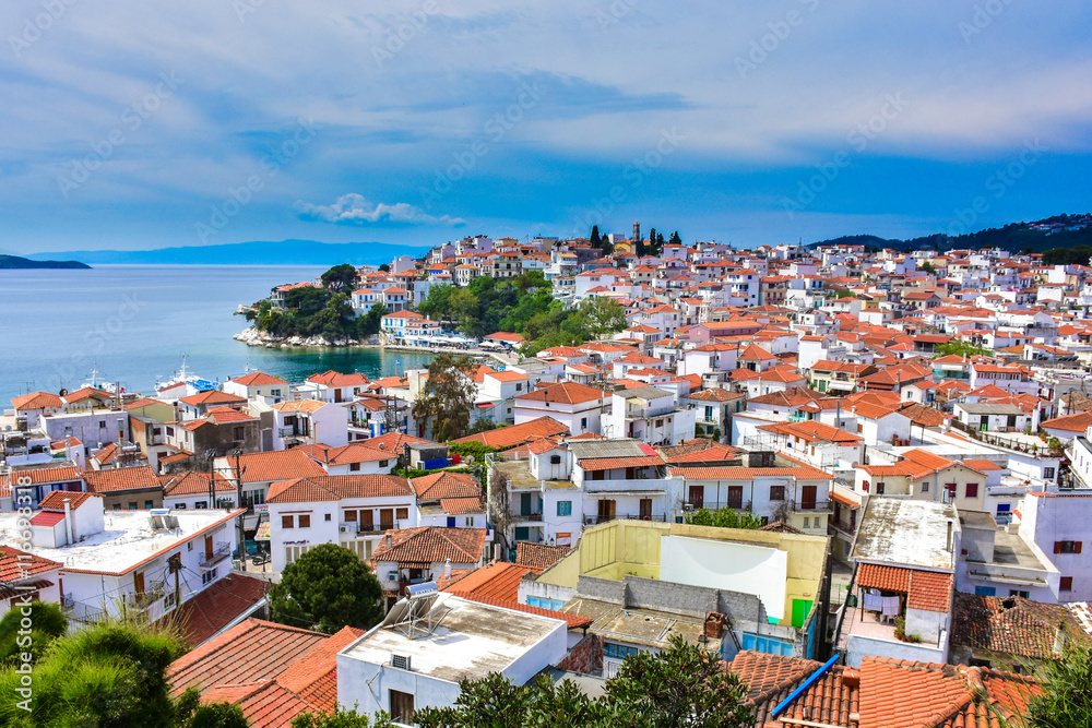 Skyathos island panorama with white houses and small pedestrian