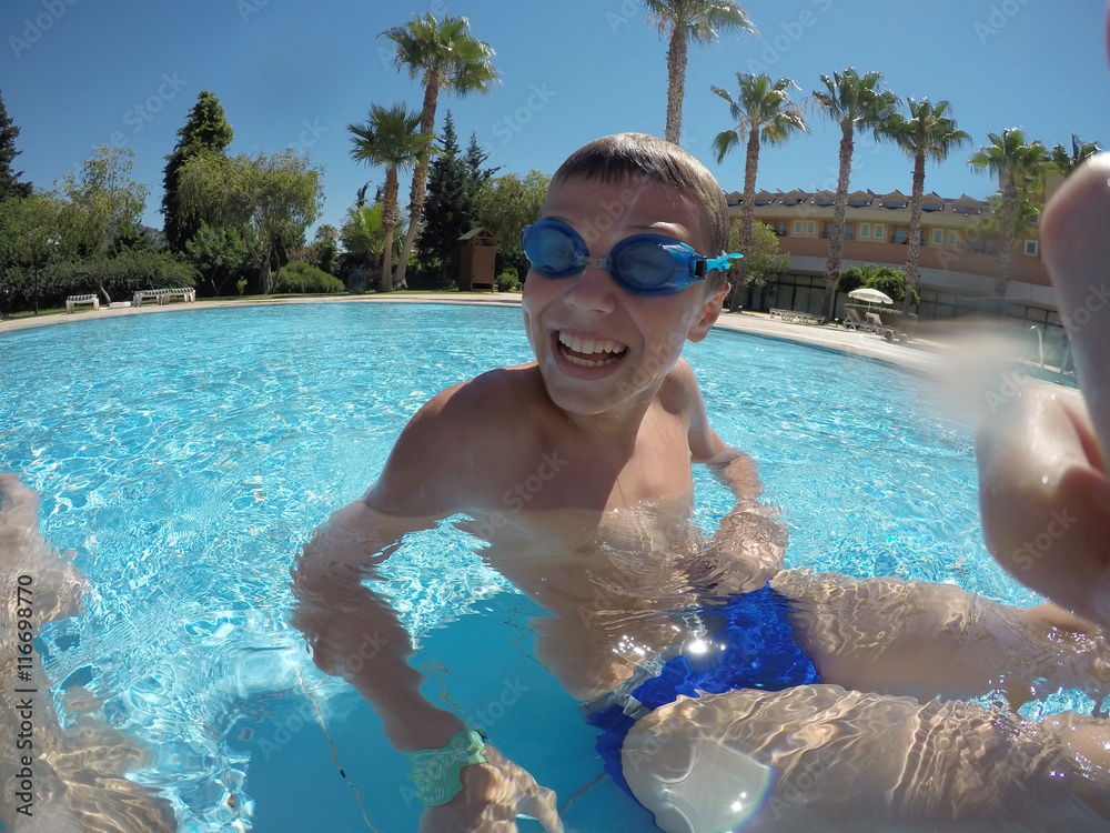smiling boy in swimming pool