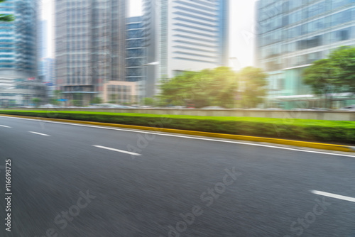 clean asphalt road with city skyline background china.