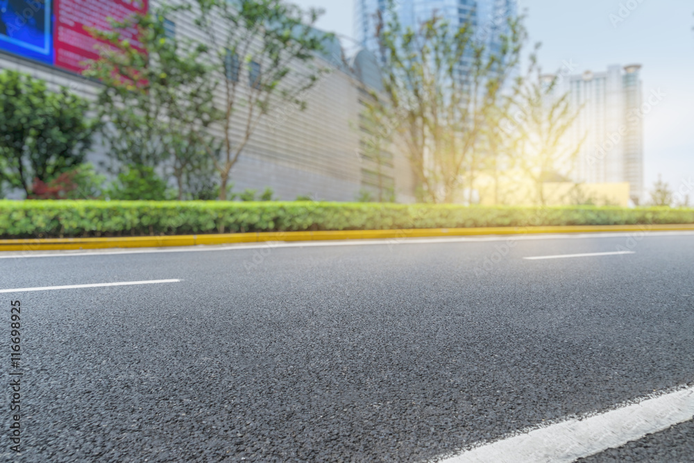 Fototapeta premium clean asphalt road with city skyline background,china.