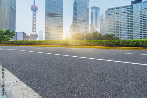 clean asphalt road with city skyline background china.