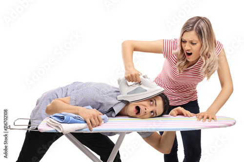 Photos Woman pressing a man with an iron