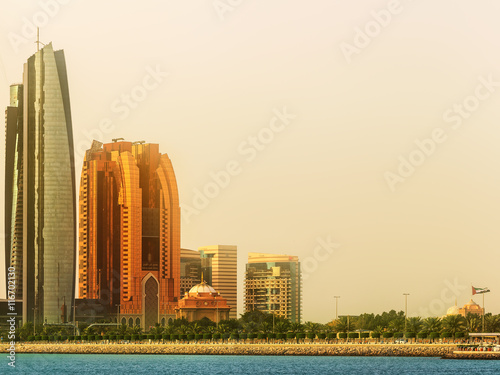 View of Abu Dhabi Skyline and Al Bateen marina at sunset, UAE photo