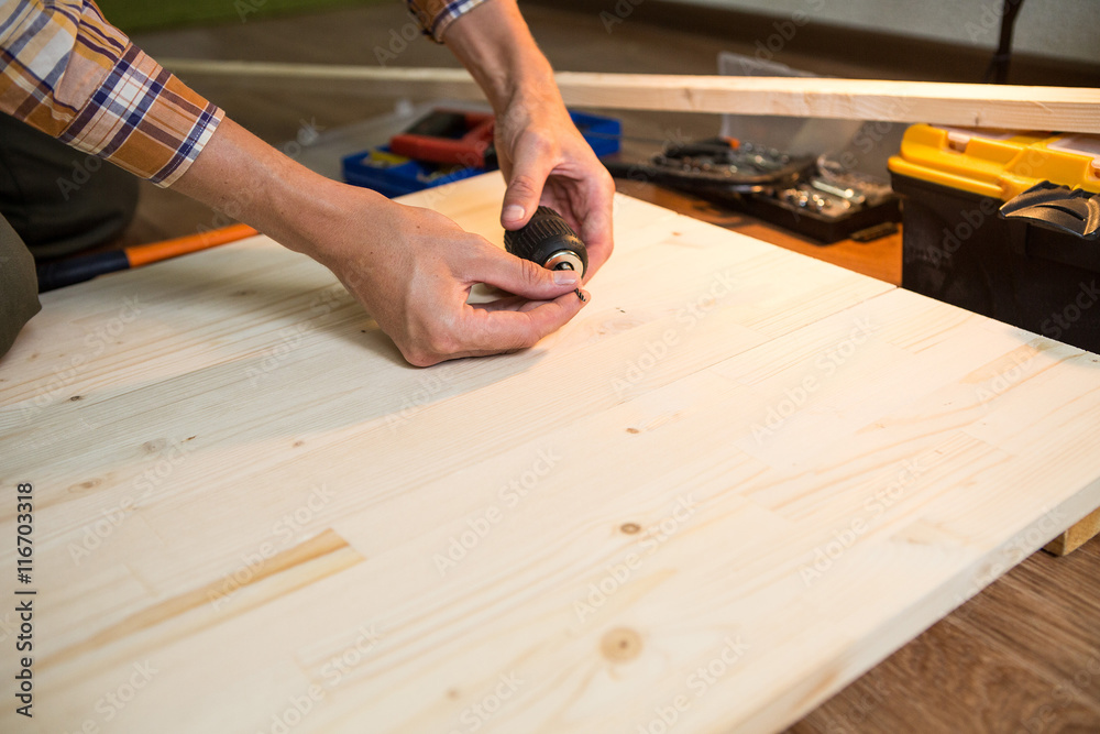 man drills board man drills board