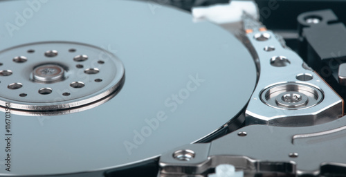 real open computer hard drive on a blue background