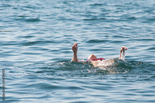 Young woman swimming in ocean