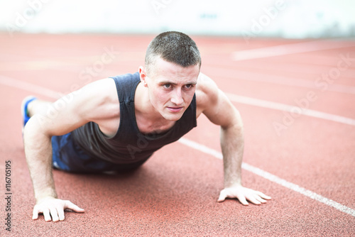 Handsome fit man exercising push up