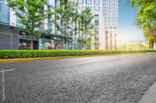 clean asphalt road with city skyline background,china.