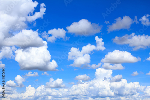 Blue sky background with white clouds and rain clouds. The vast blue sky and clouds sky on sunny day. White fluffy clouds in the blue sky.