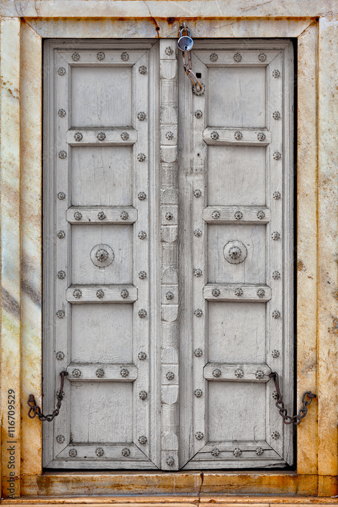 Agra, India. The old gray wooden door