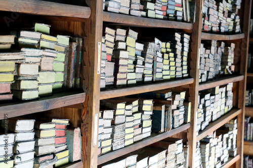 Old books on library shelves