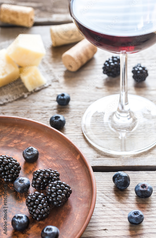 Bowl of blackberries on the wooden table Bowl of blackberries on the wooden table