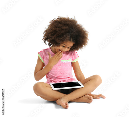 Happy African girl with tab...