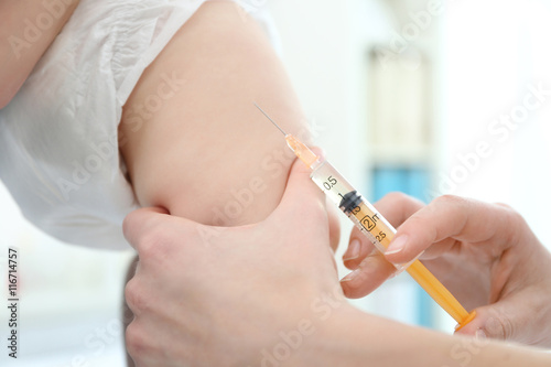 Doctor vaccinating baby