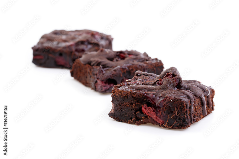 Delicious vegetarian brownie with cherries isolated on white bac Delicious vegetarian brownie with cherries isolated on white bac